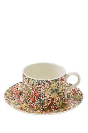 فنجان شاي وطبق بنقشة زهور