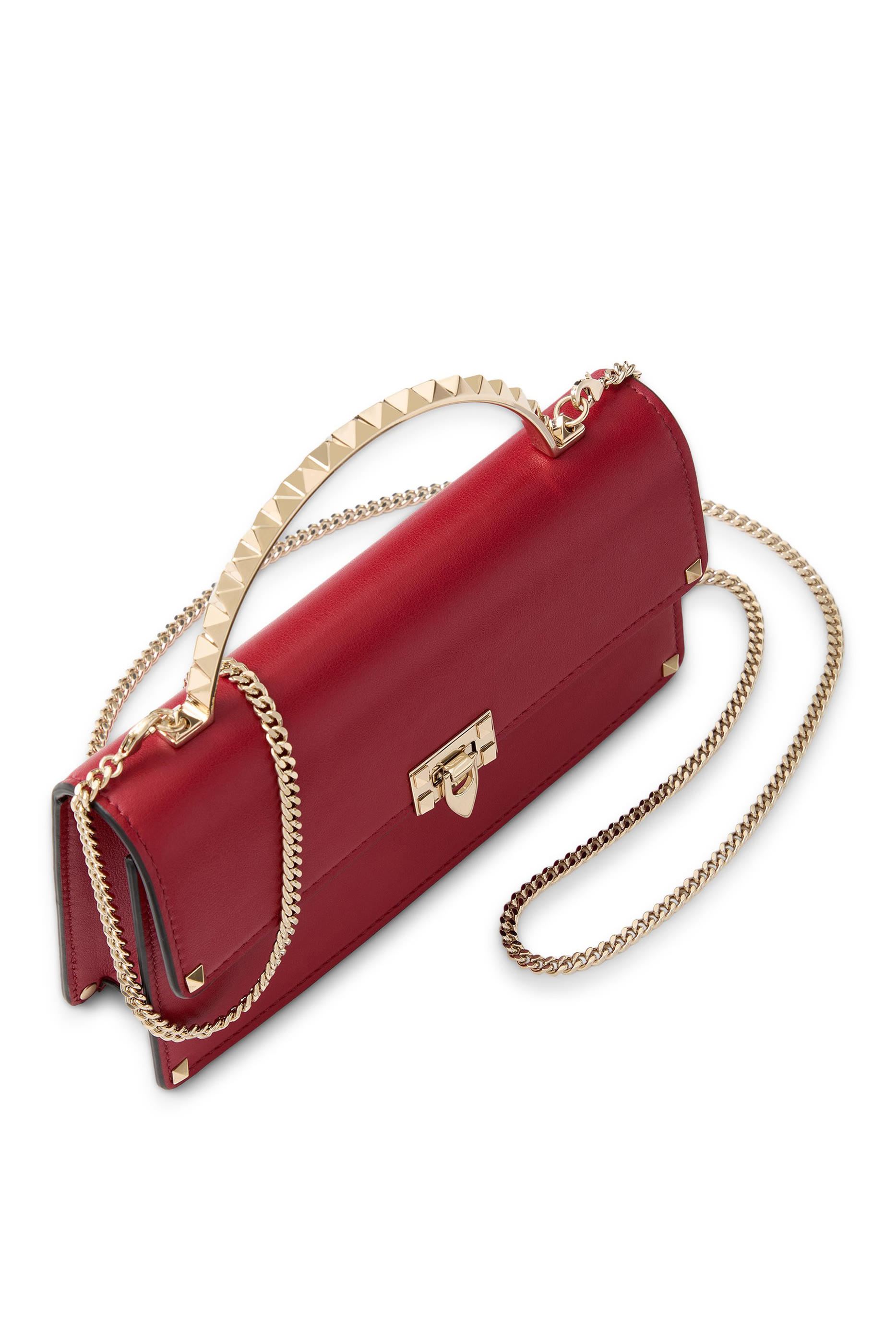 حقيبة يد صغيرة مرصعة بحلي هرمية