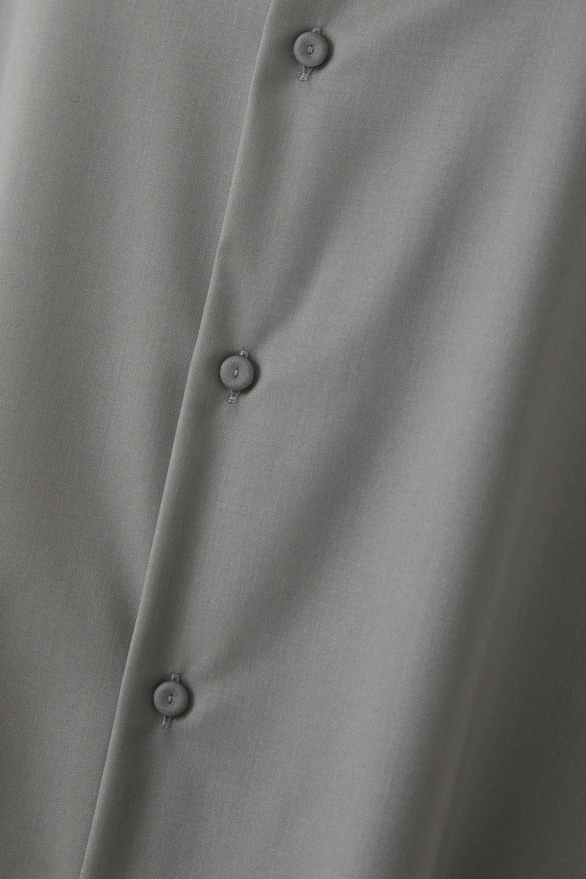 قميص مالك بلا أكمام صوف بكر