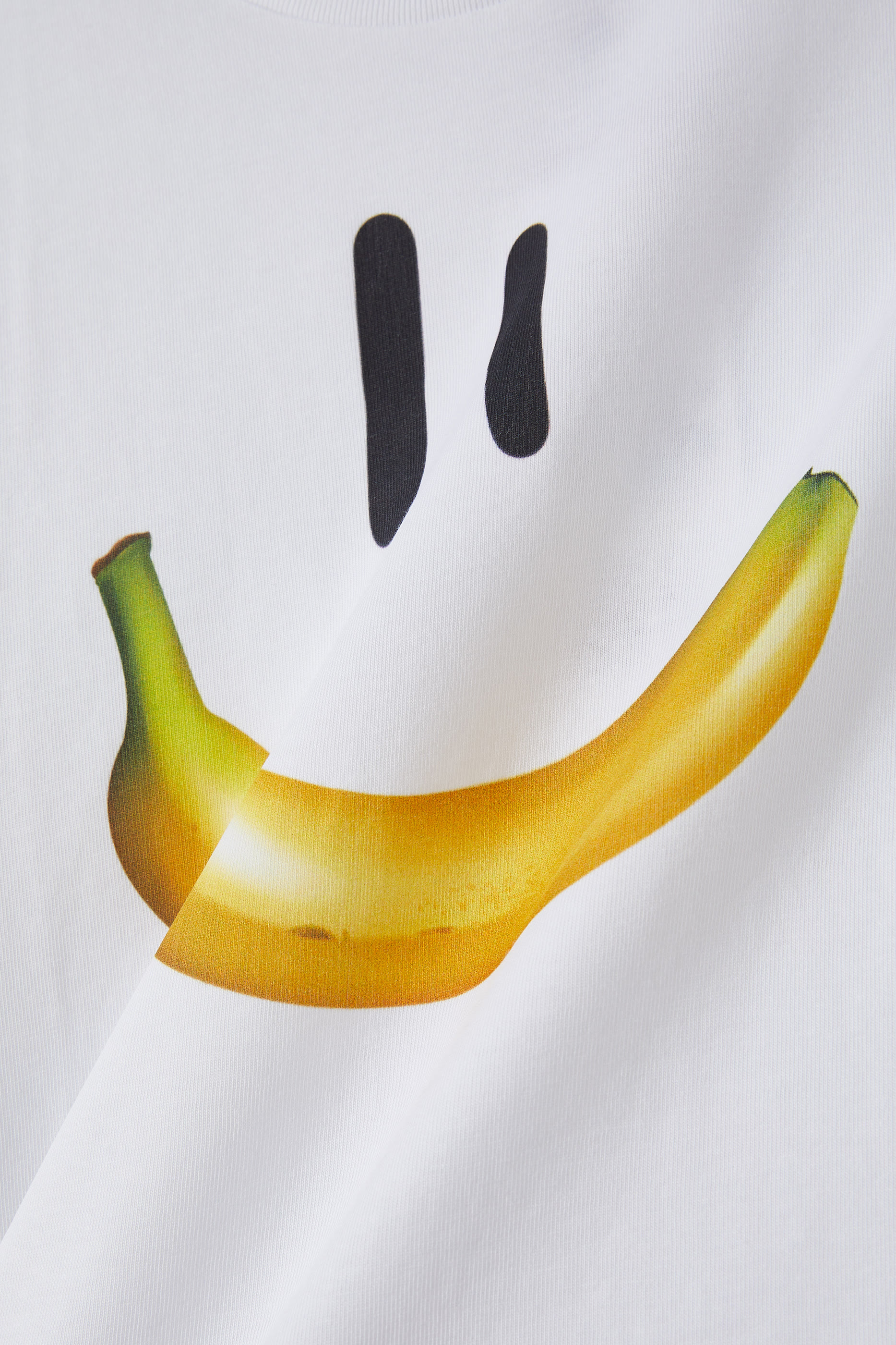 تيشيرت رايلي بنقشة وجة ضاحك بتصميم موزة للأطفال