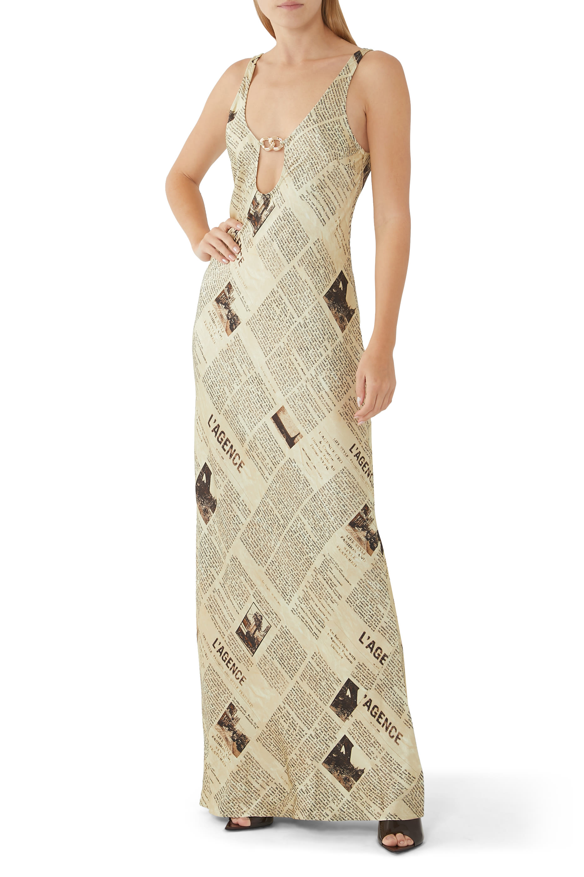 فستان ياسمين بفتحات ونقشة جرائد