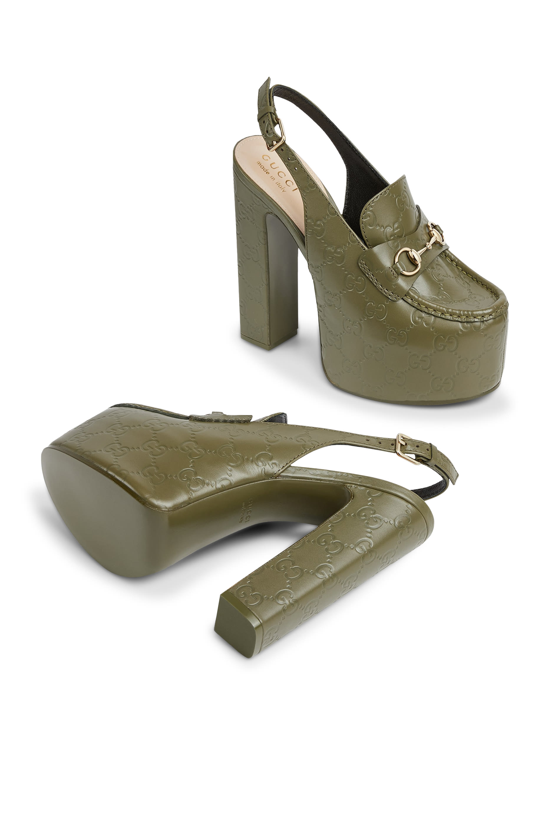 حذاء كلاسيك 145 بنعل سميك بسير خلفي وحلية بشعار الماركة