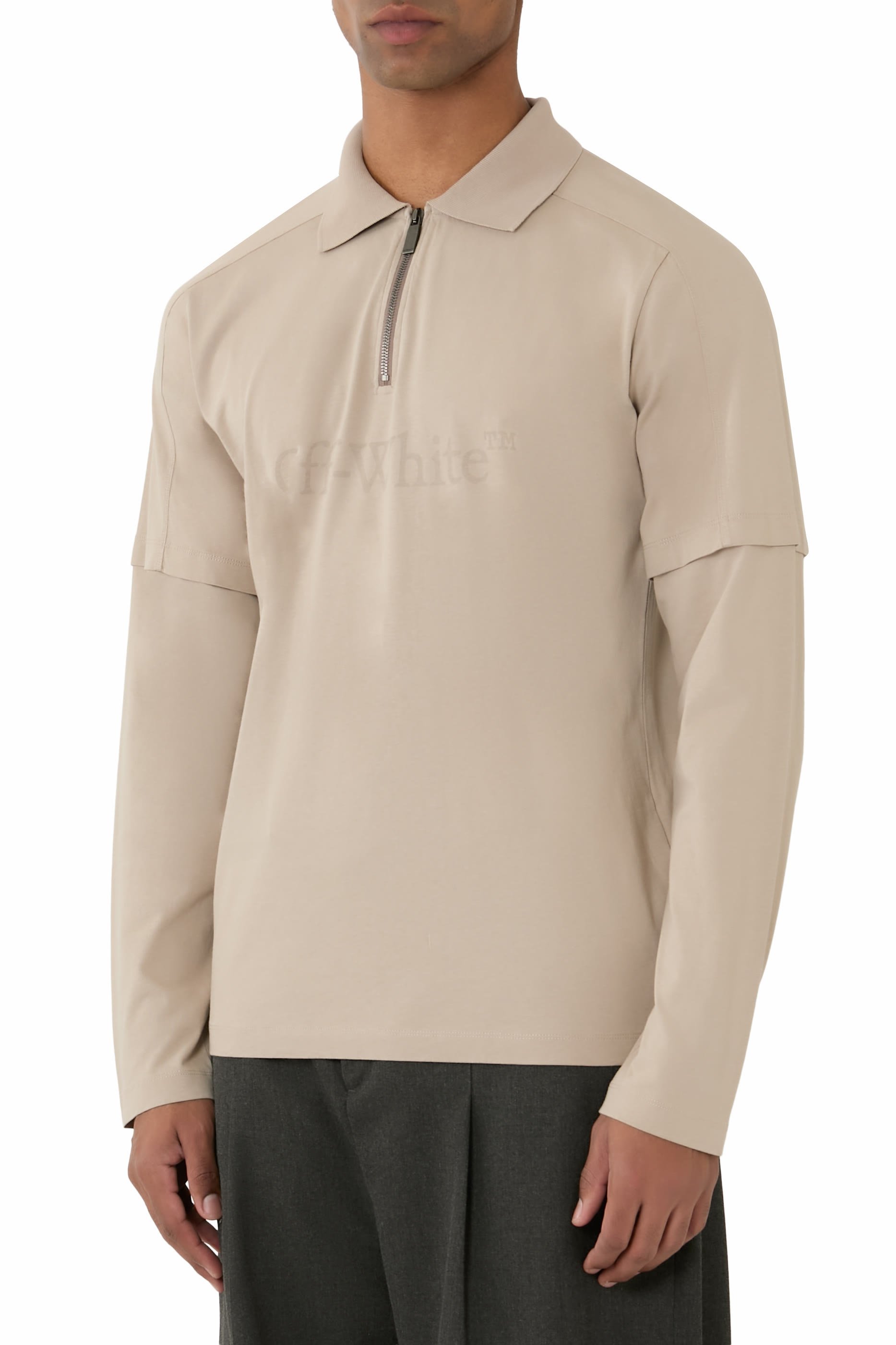 قميص بولو بأكمام مزدوجة وشعار الماركة بحجم كبير