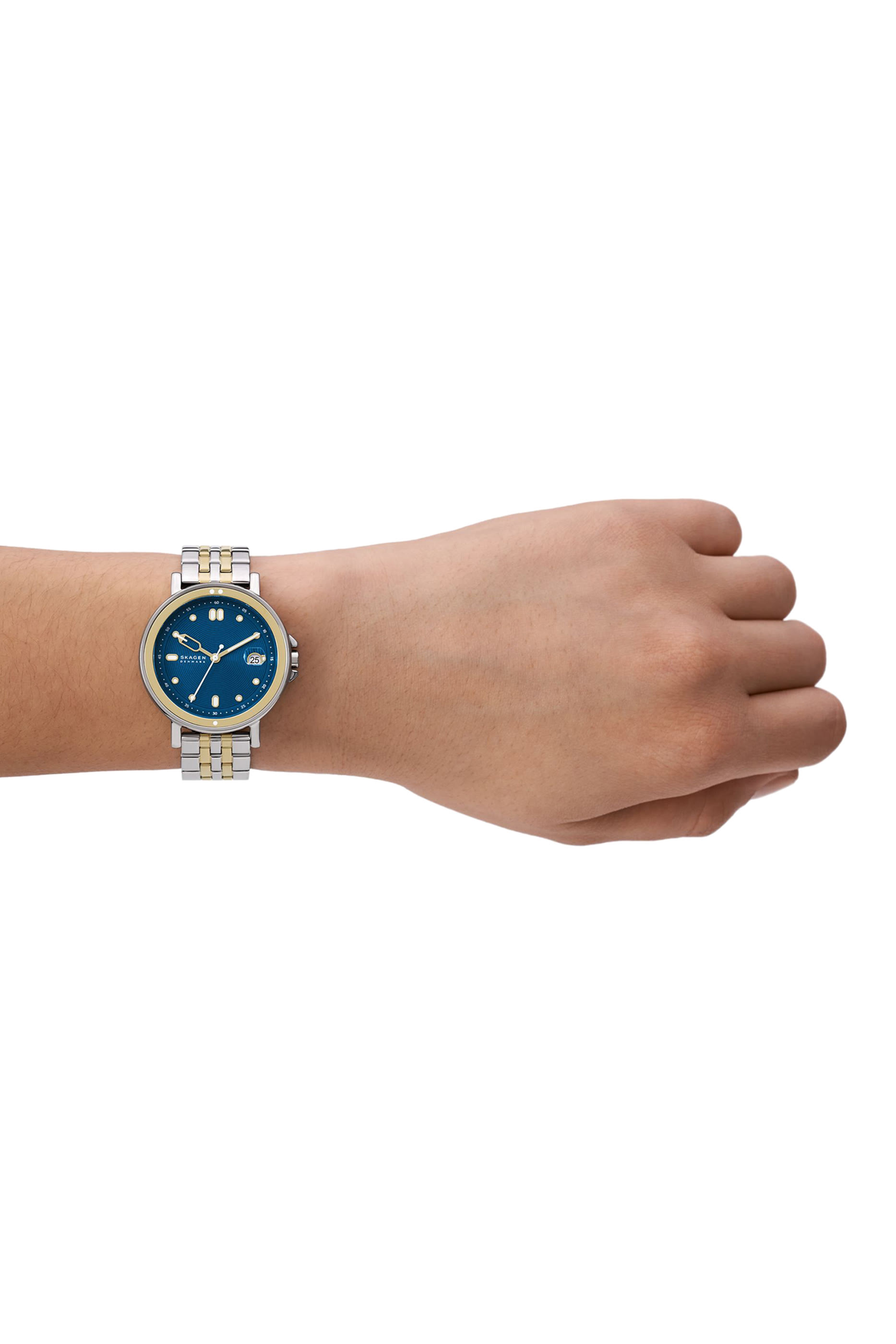 ساعة ليل رياضية بشعار الماركة مع ثلاث عقارب وسوار ستانلس ستيل