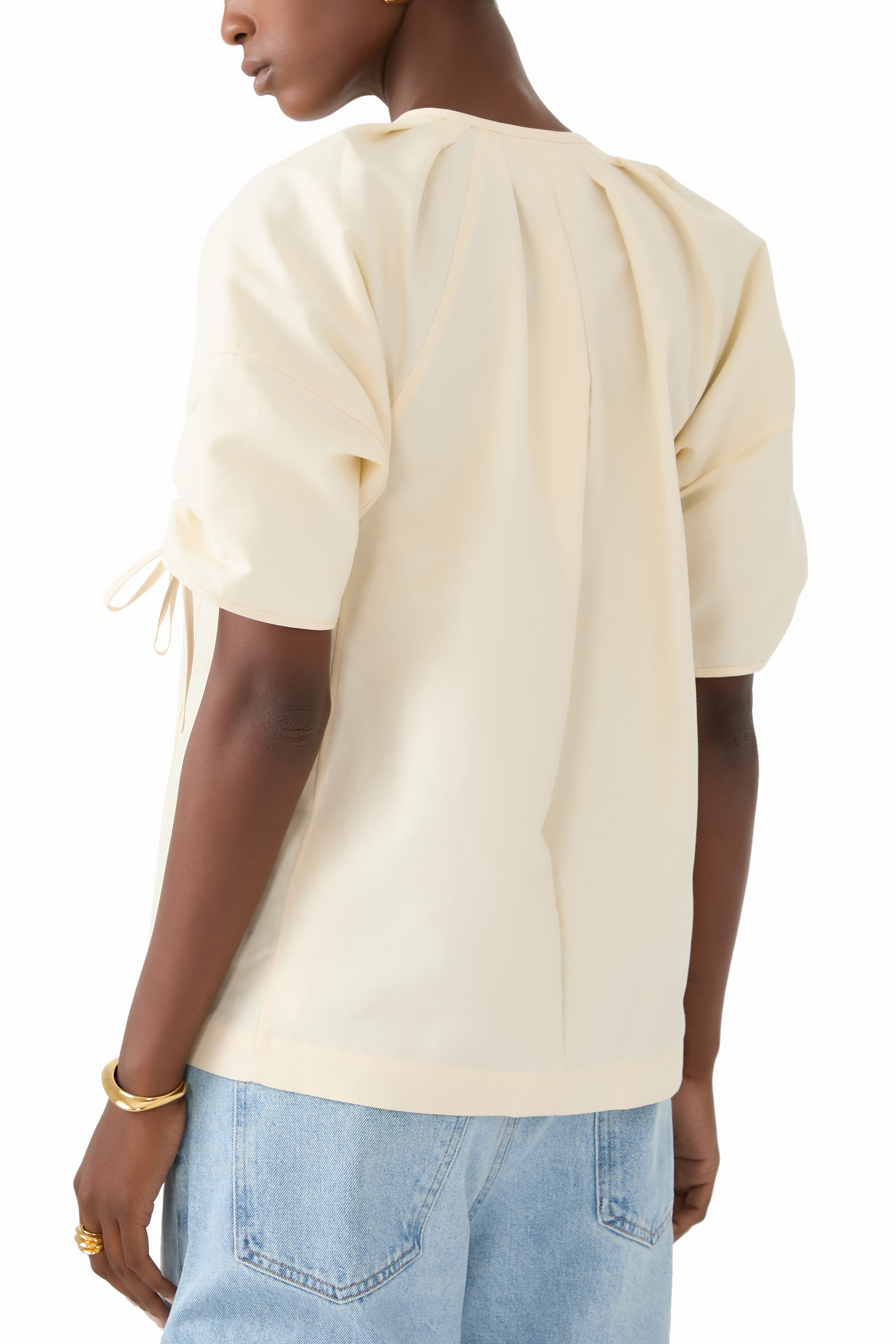 بلوزة بأكمام برباط تضييق وياقة ضيقة