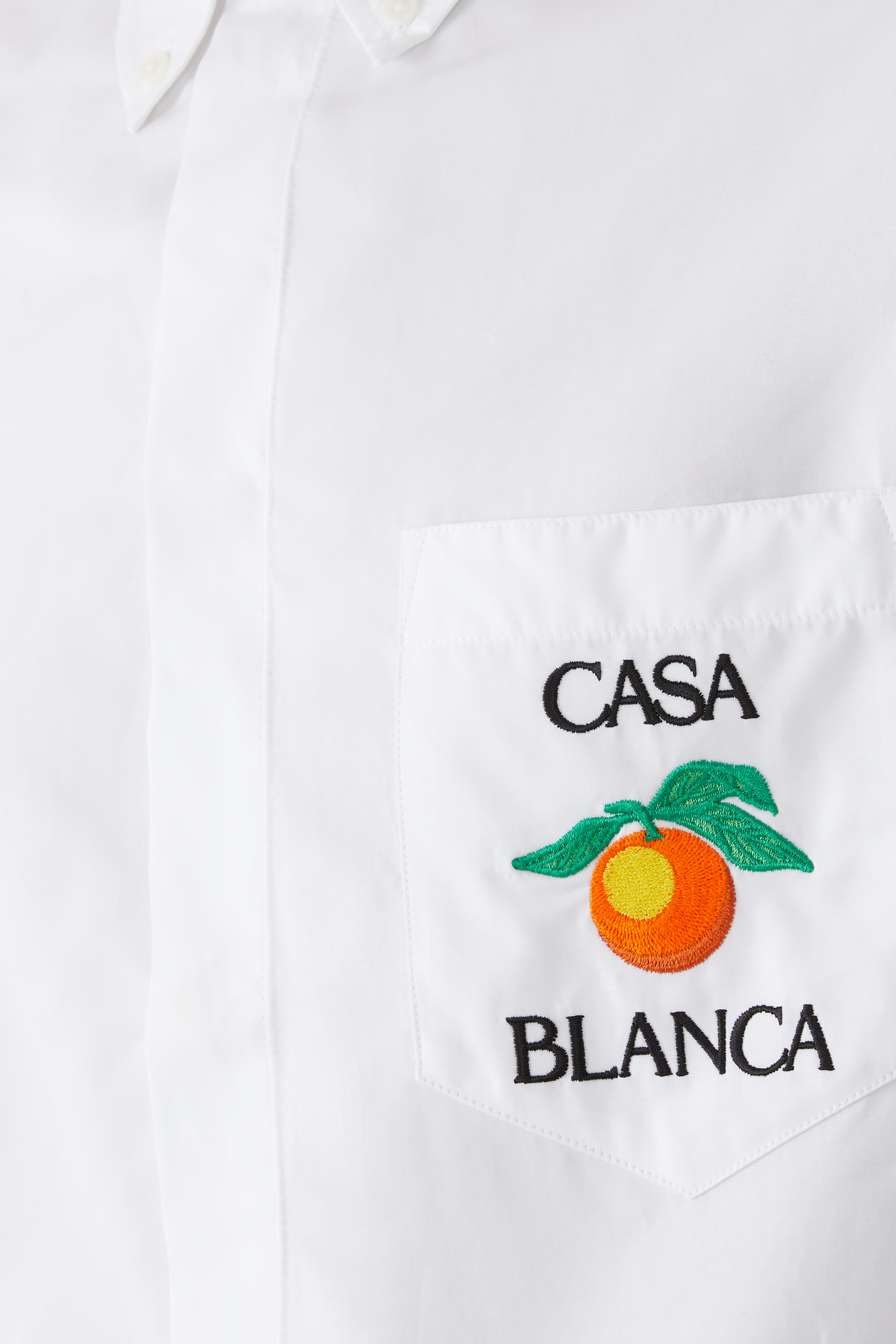 قميص اوكسفورد بتطيريزات برتقال