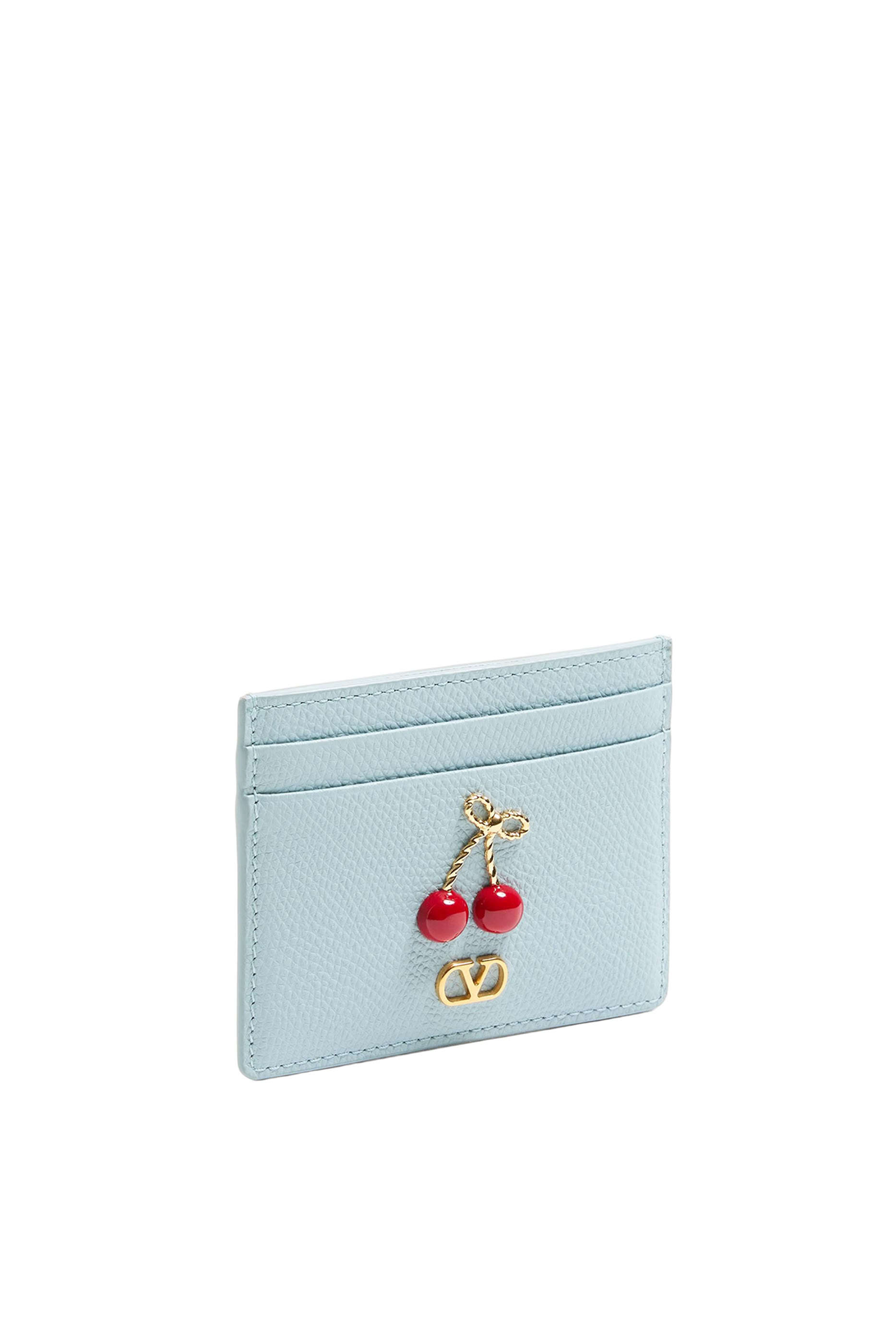 محفظة مزينة بكرز