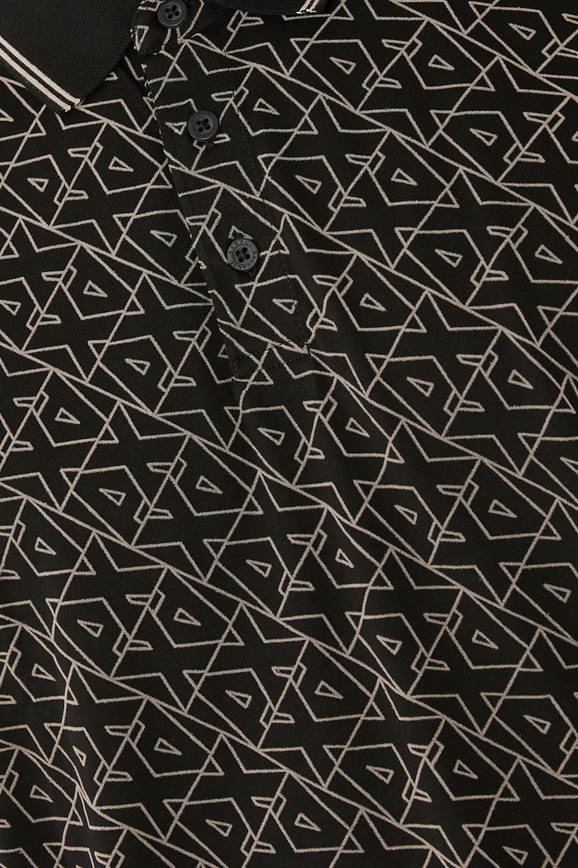 قميص بولو بقصة عادية مزين بشعار الماركة بالكامل