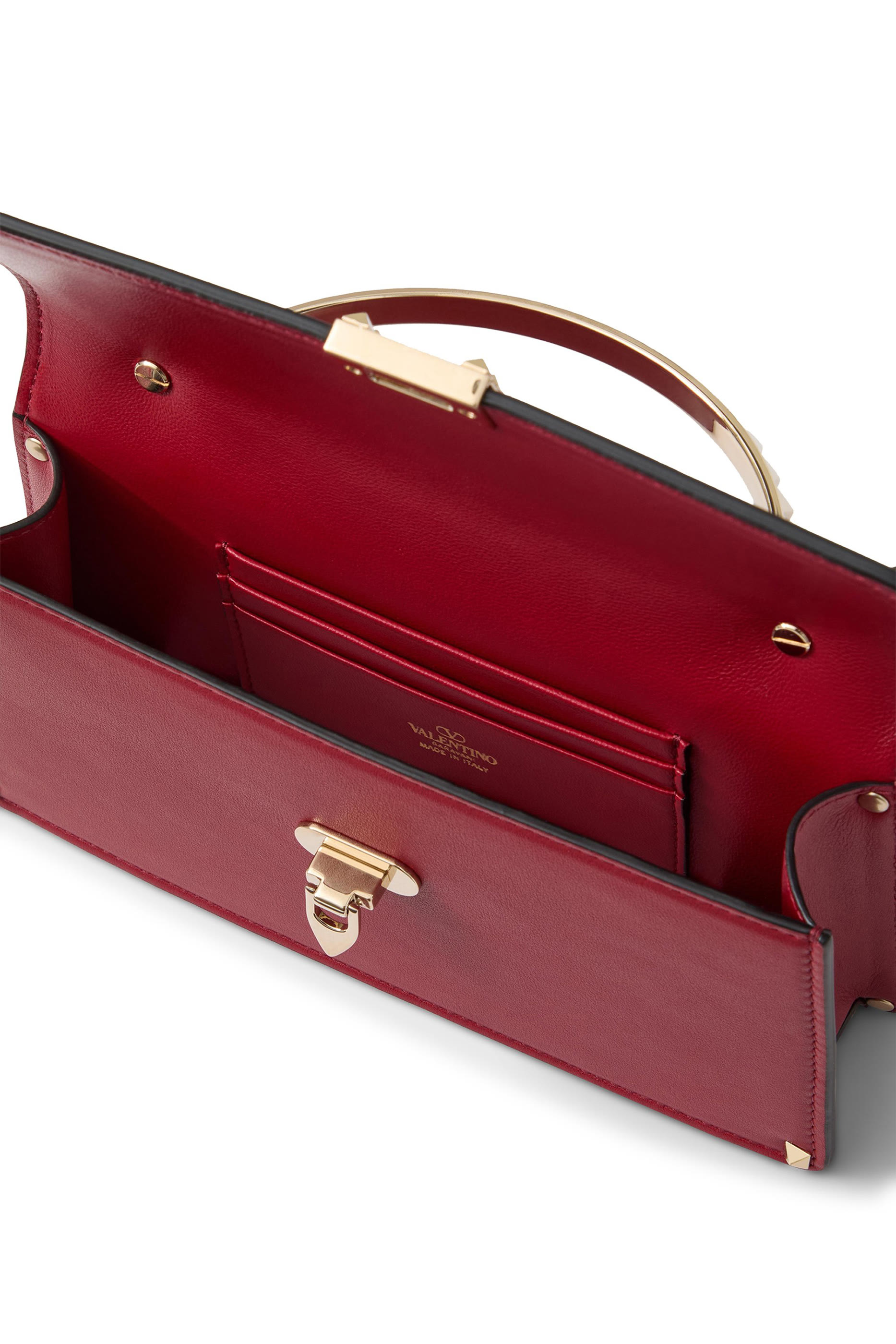 حقيبة يد صغيرة مرصعة بحلي هرمية