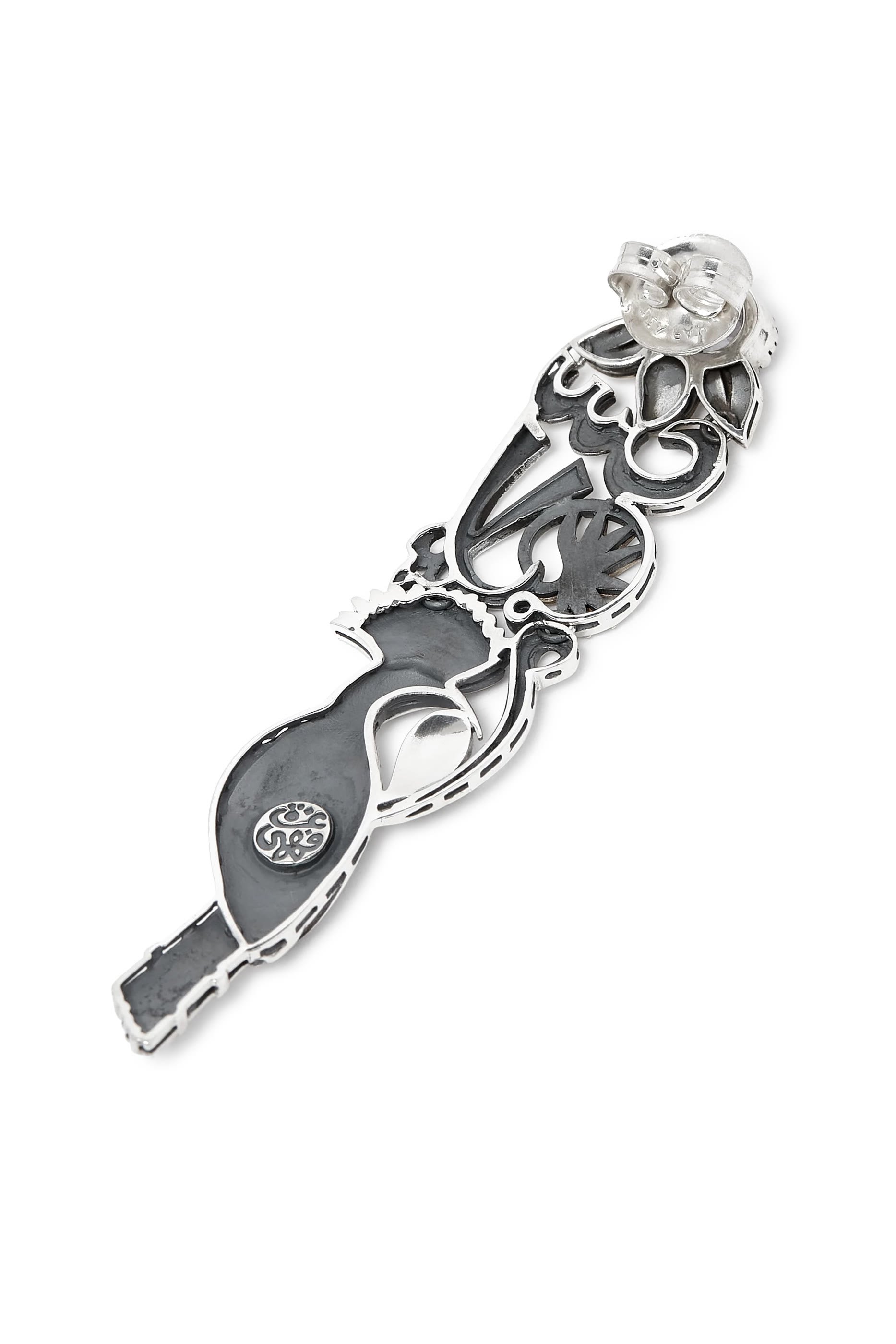 قرط منفرد بنقشة كلمة سلام ورمز الحكمة