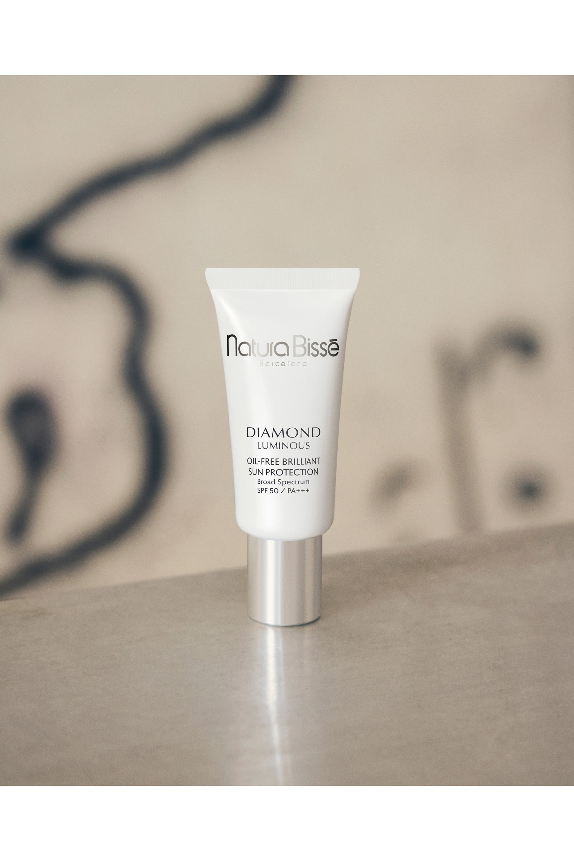 واقي الشمس دياموند وايت SPF 50+&rlm;&rlm;