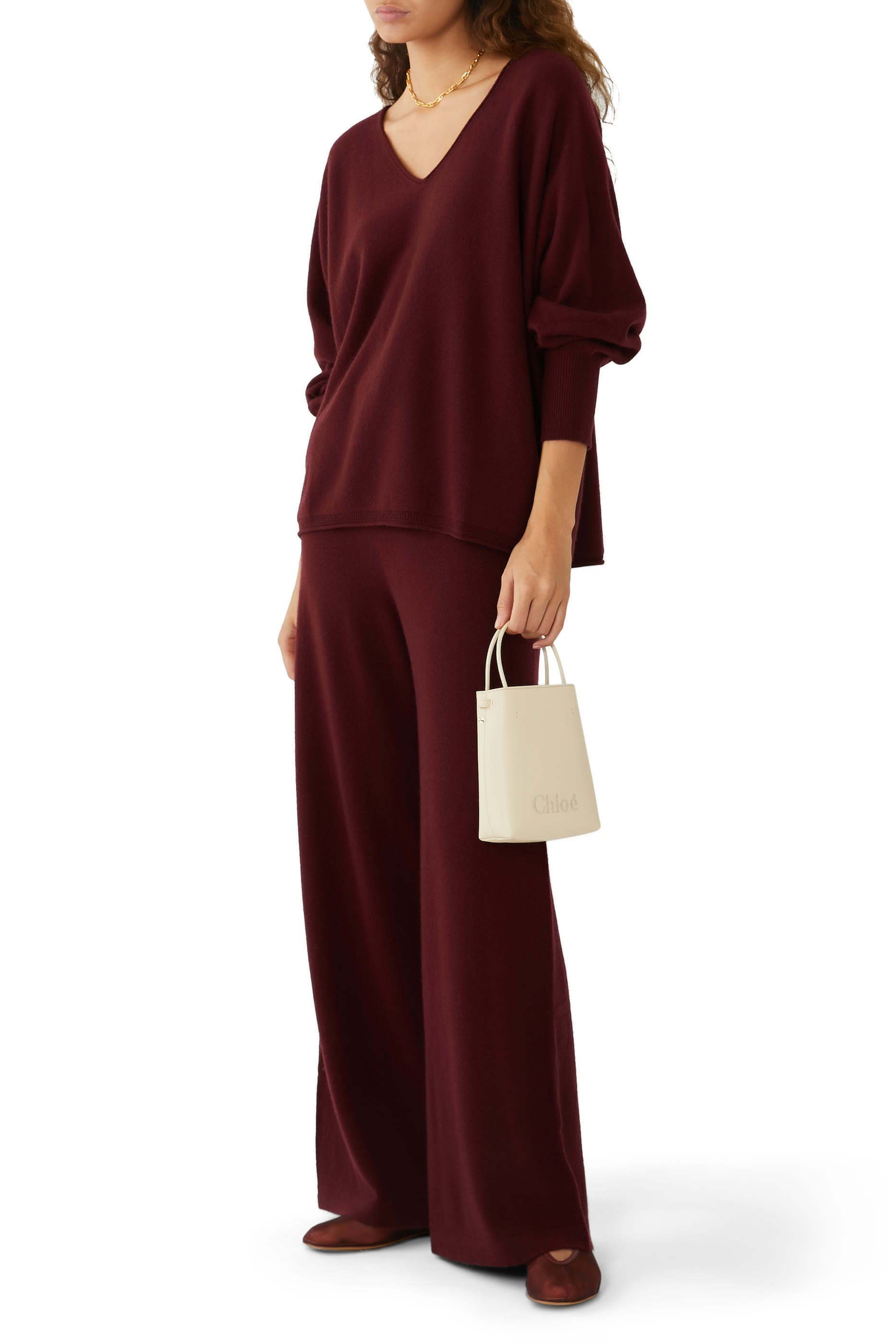 حقيبة سينس صغيرة بشعار الماركة المحاك