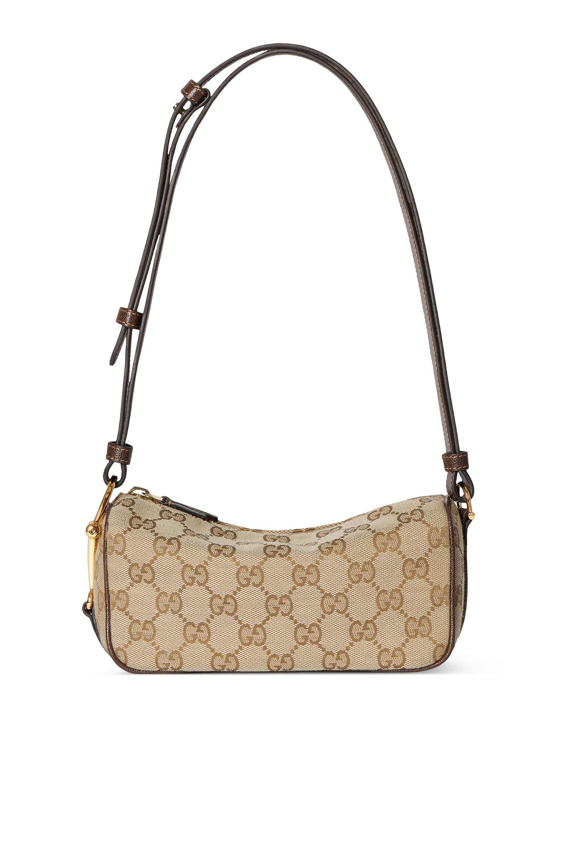 حقيبة صغيرة بحافة بتصميم مقوس وحلية لجام الحصان