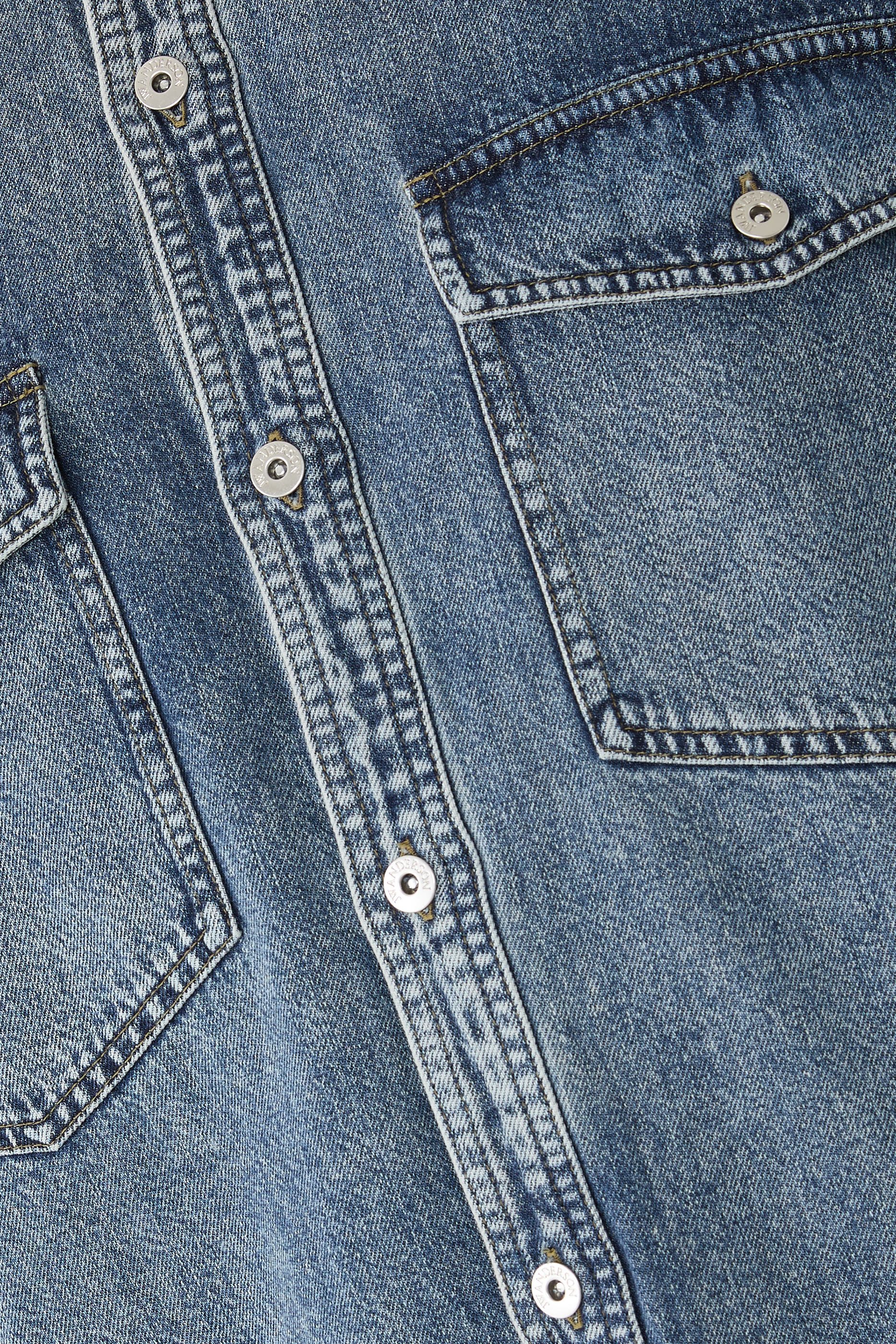 قميص بقصة فضفاضة دنيم