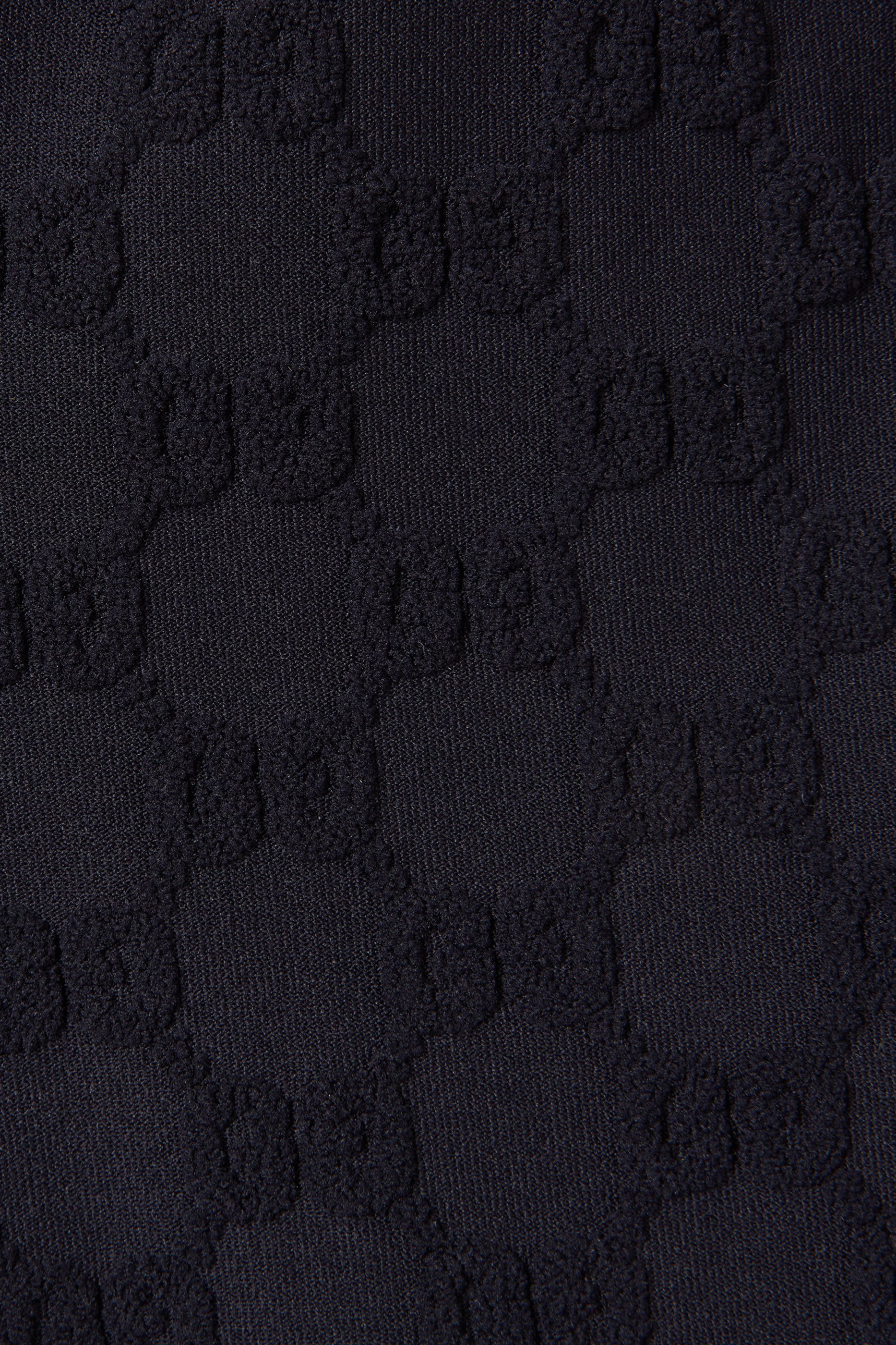 لغينغز جيرسيه بنقشة حرفي شعار الماركة للأطفال