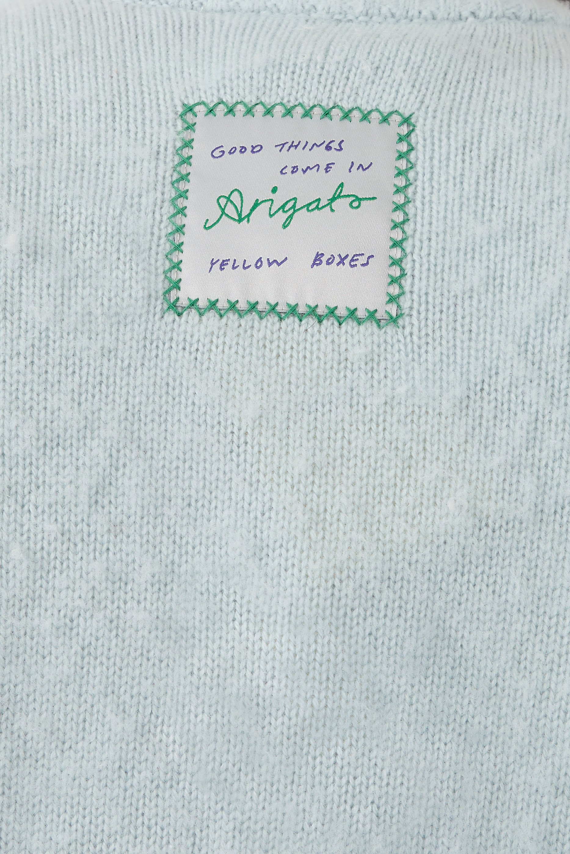 كنزة برقعة شعار الماركة