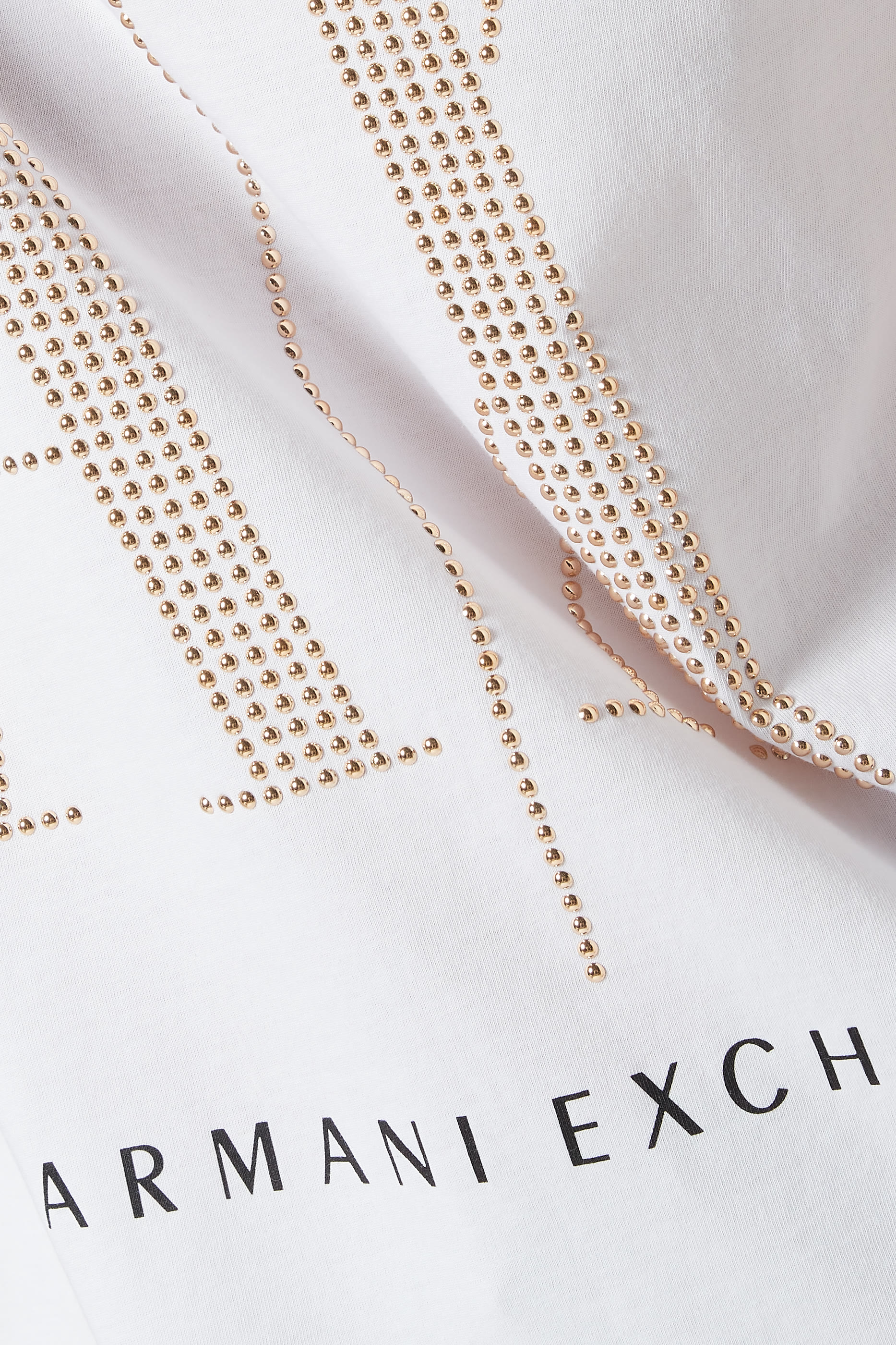 تي شيرت أيكون بحلي معدنية على شكل شعار الماركة