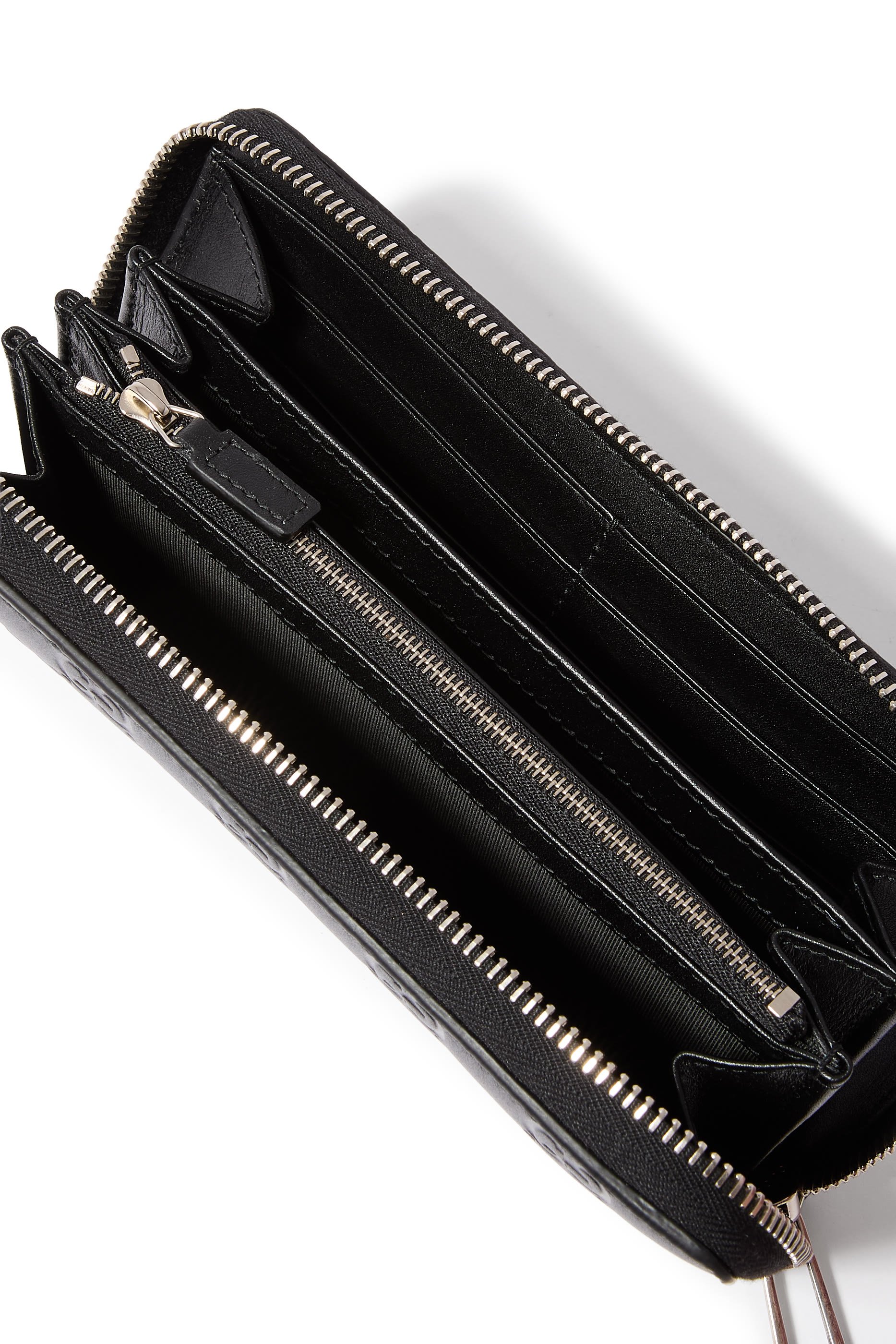 محفظة بسحاب محيط ونقشة حرفي شعار الماركة