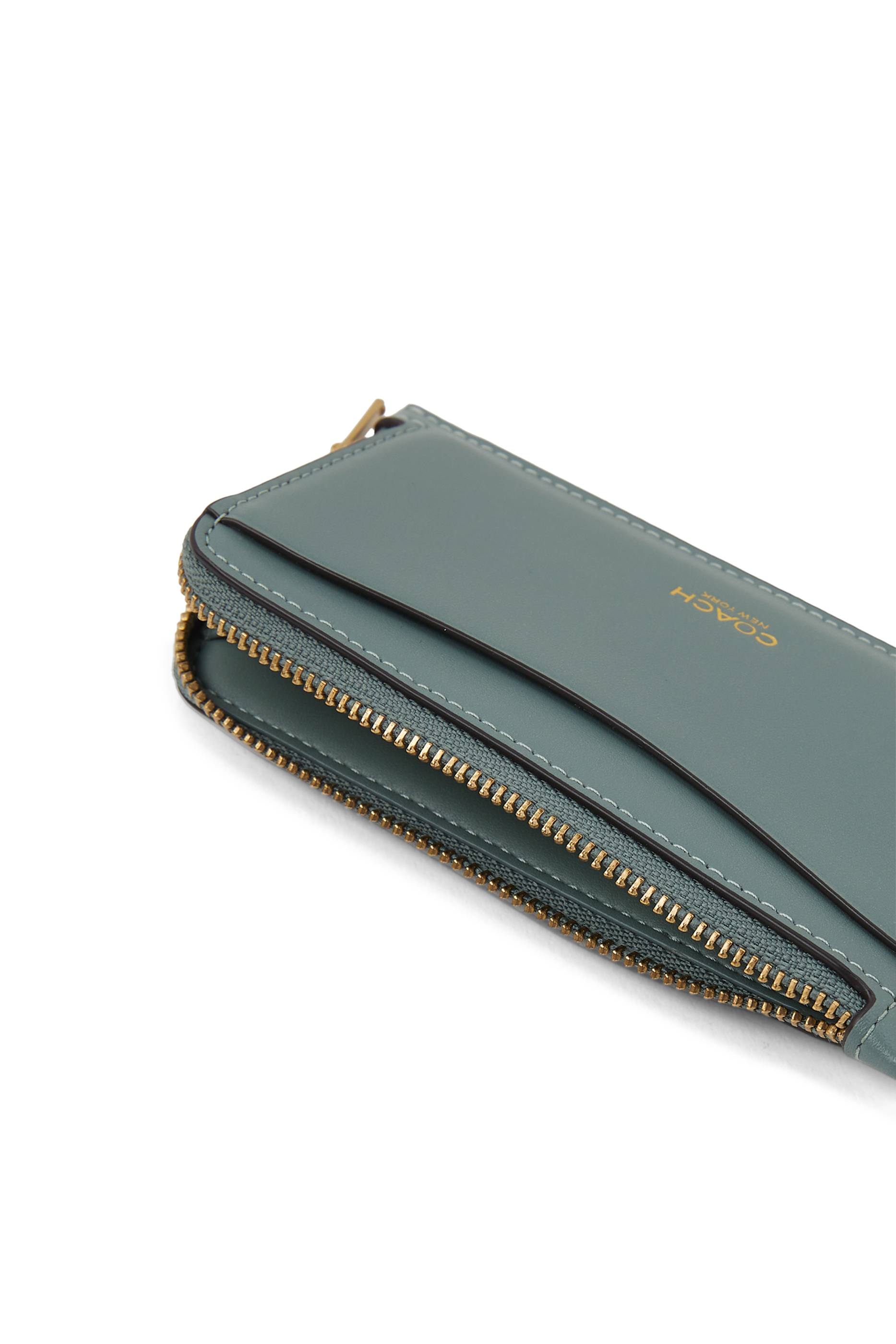 محفظة بسحاب محيط جلد