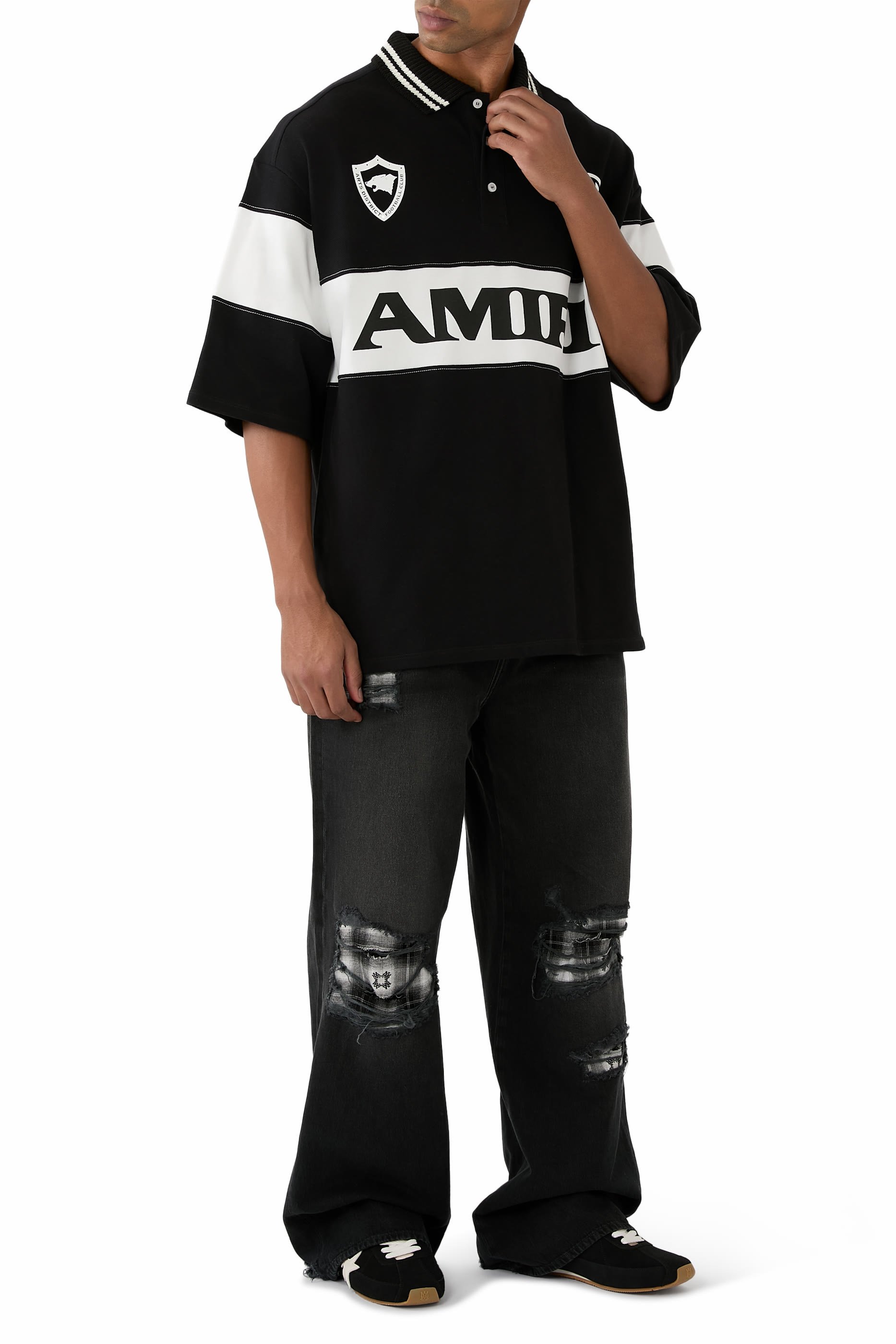 قميص بولو رياضي بقصة فضفاضة