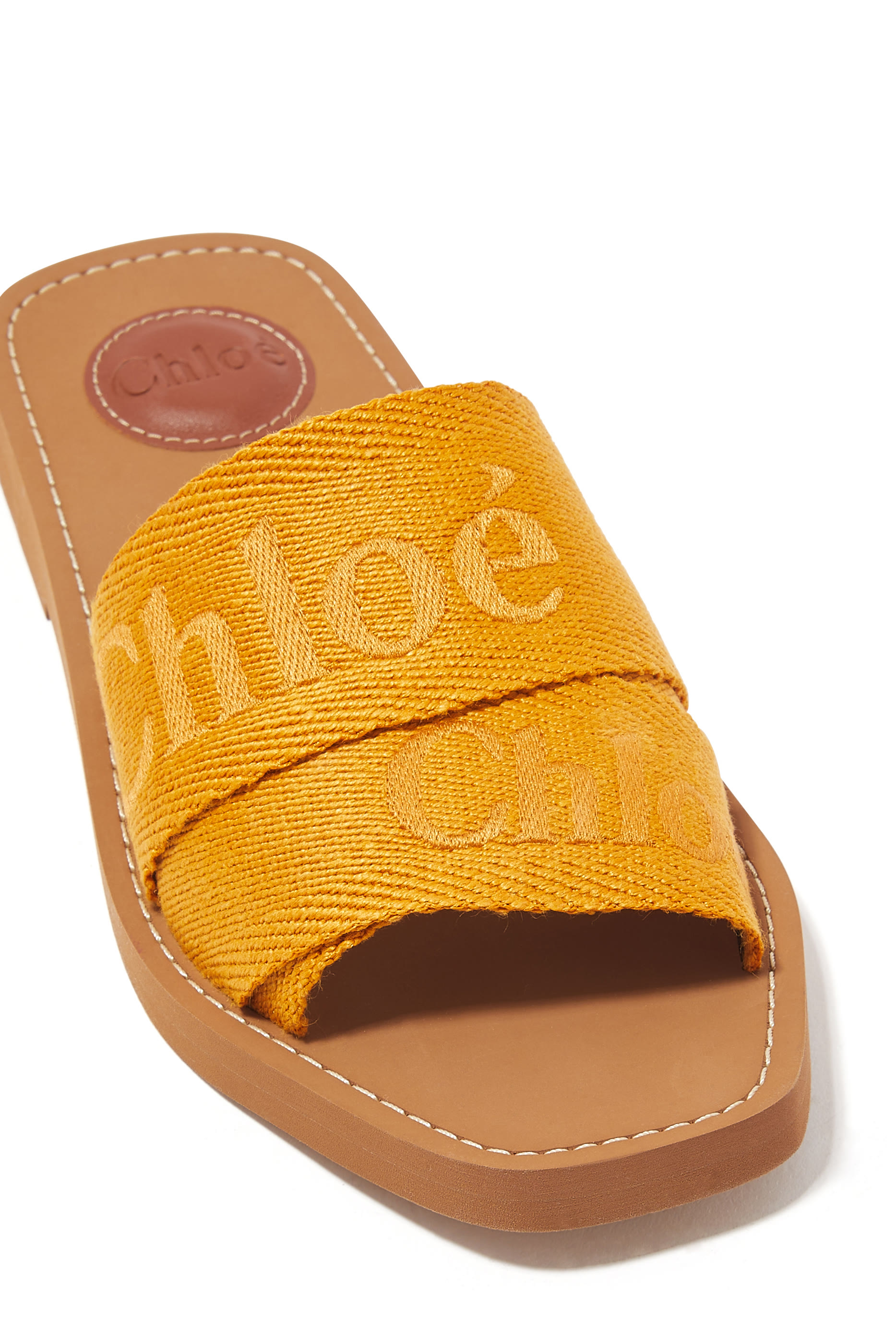 حذاء وودي مفتوح من الخلف بنعل مسطح دنيم