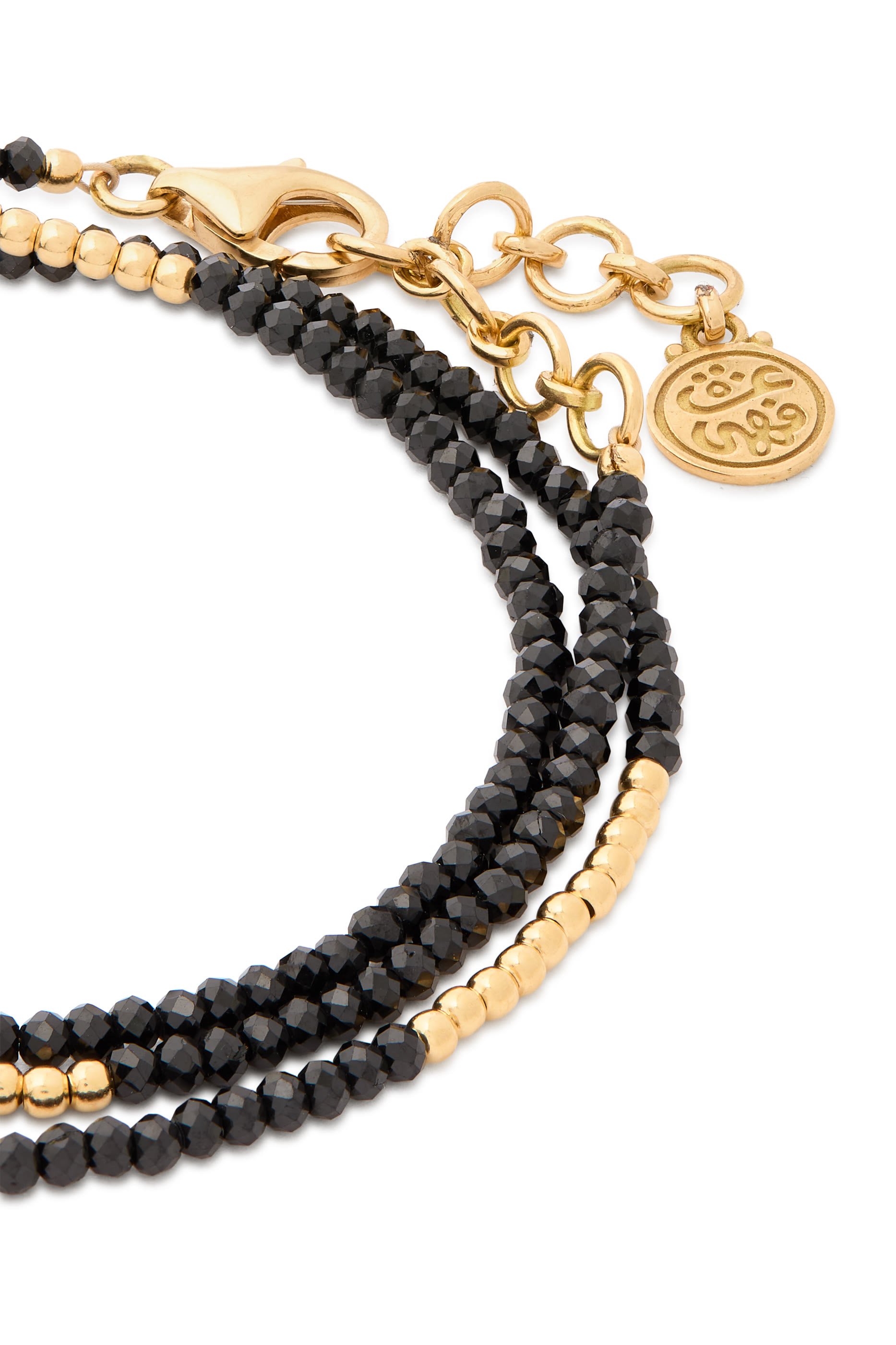 سوار ووندرز اوف نيتشر بتصميم ملفوف مرصع بالإسبينيل ذهب أصفر عيار 18