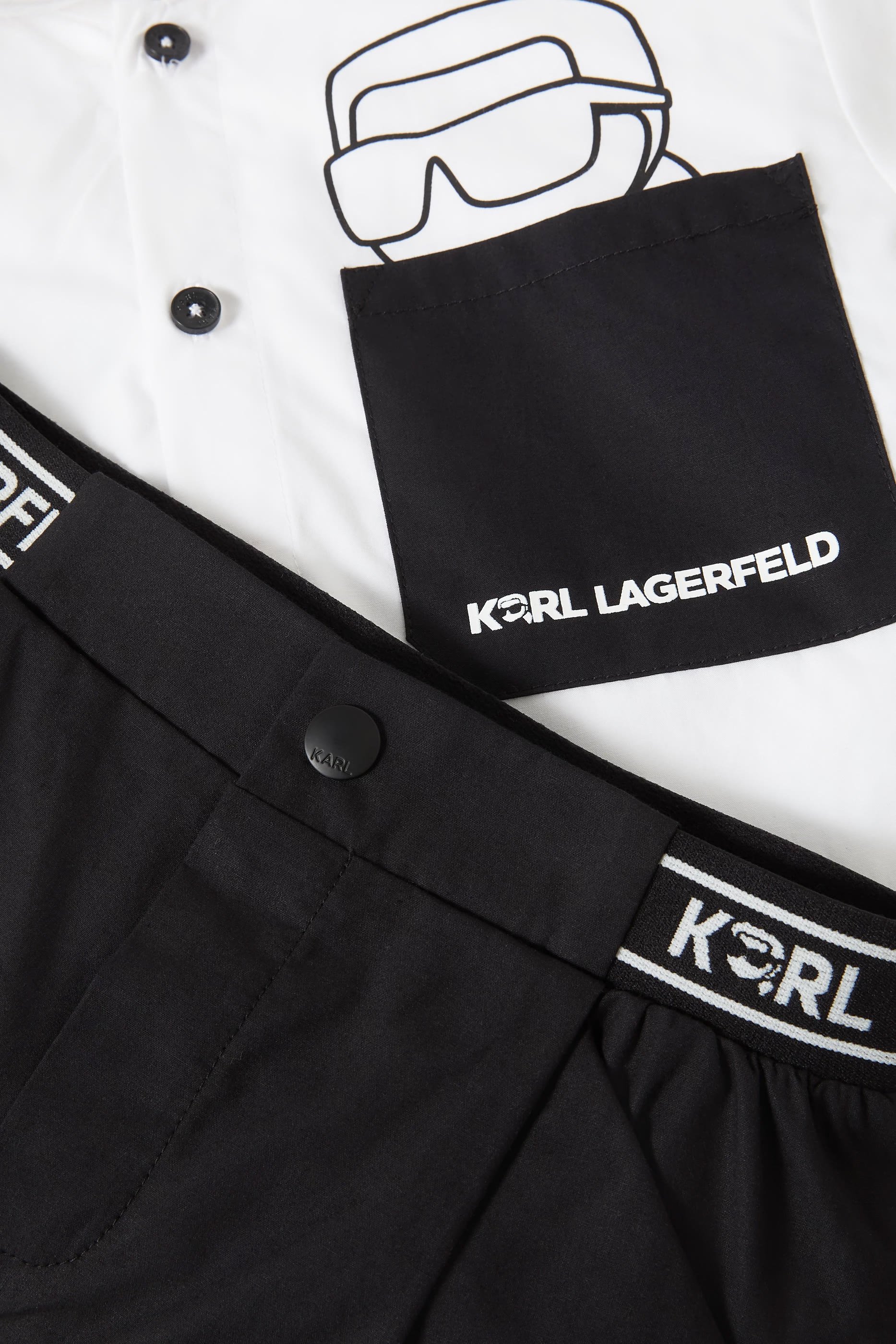 طقم شورت وتيشيرت بشعار الماركة للأطفال