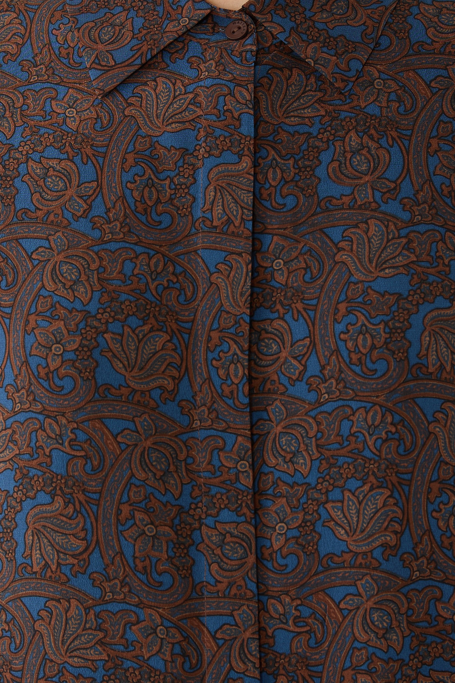 قميص بقصة فضفاضة بأكمام قصيرة