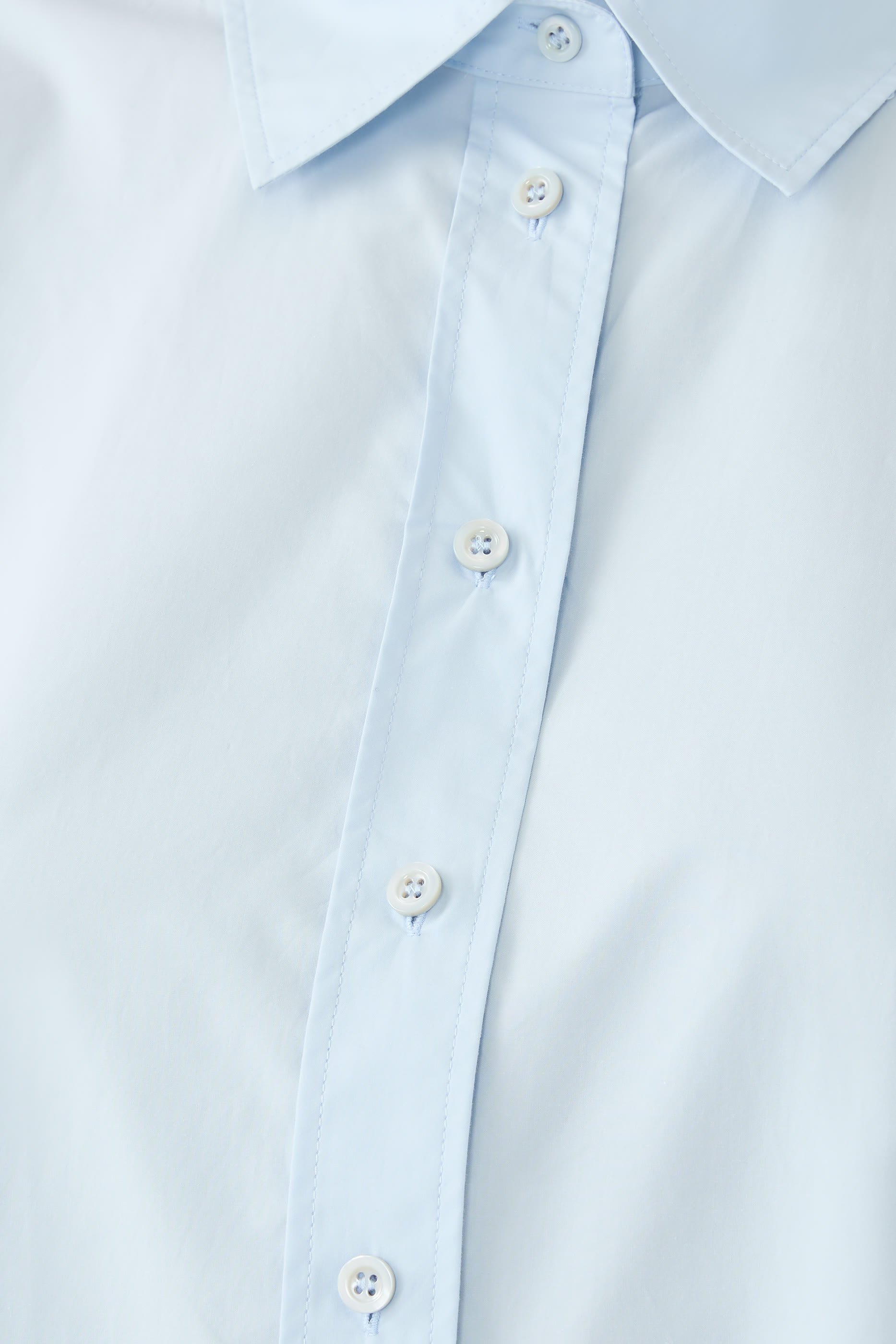 قميص بقصة فضفاضة