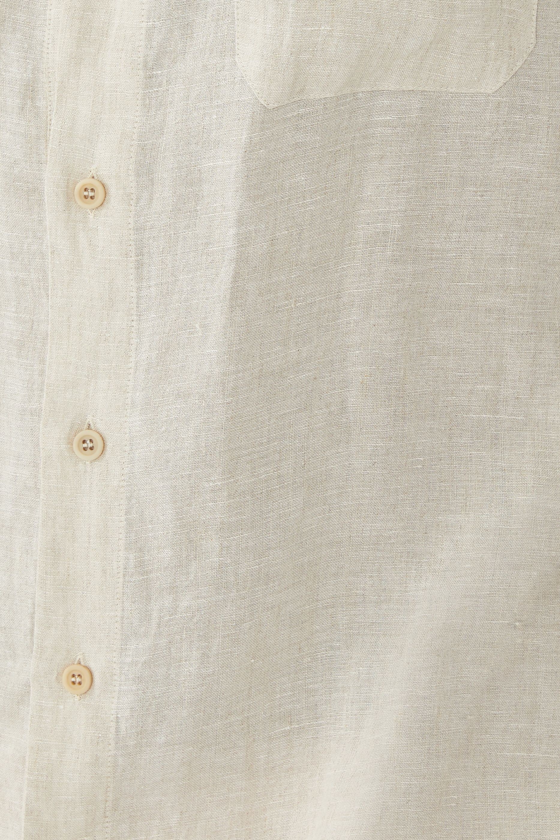 قميص بحافة مقوسة