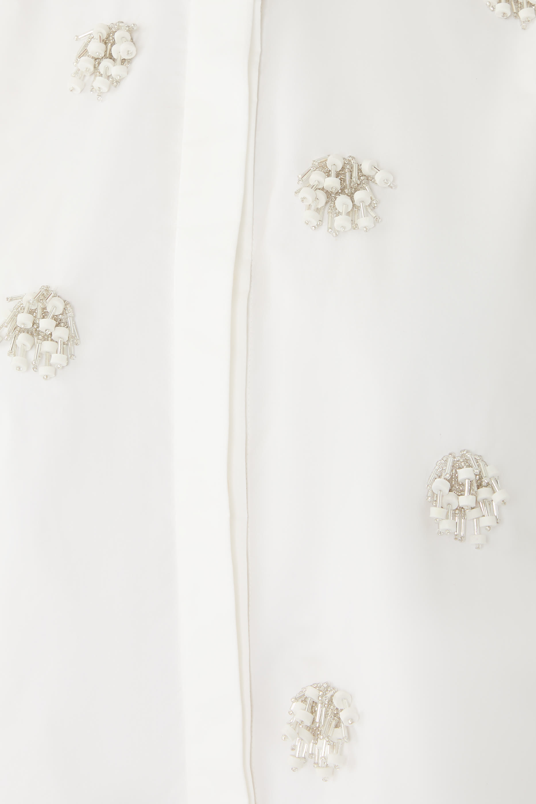 قميص كوزمو بياقة مطوية وتطريزات