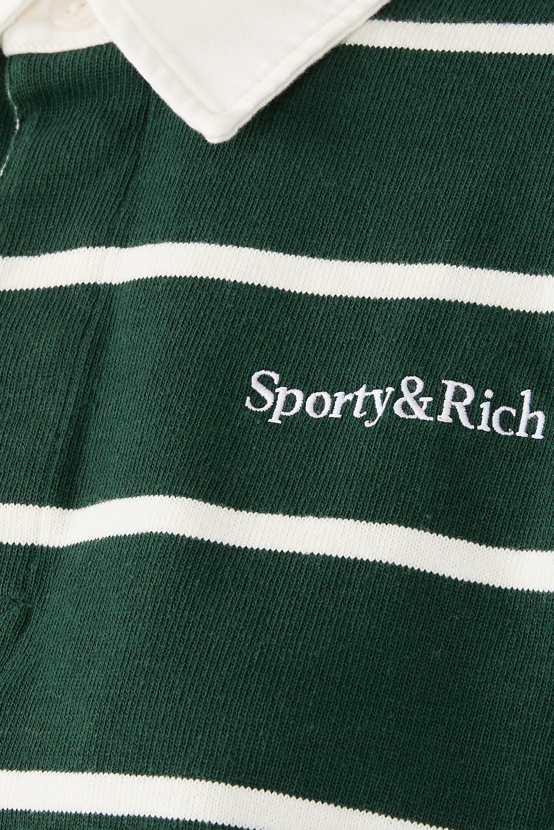 قميص بولو رجبي بقصة قصيرة وشعار الماركة بخط سيريف