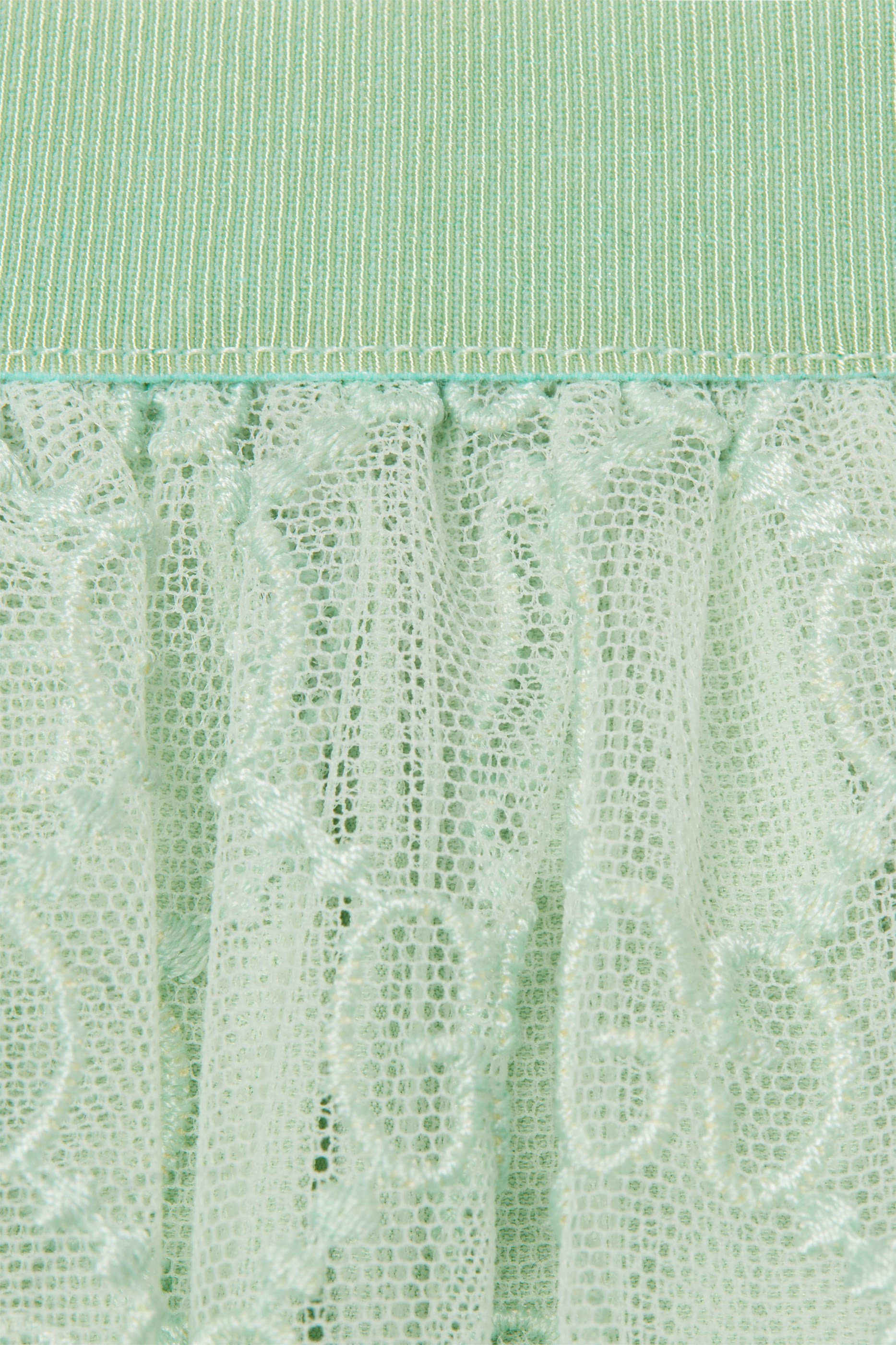 تنورة تول بنقشة حرفي شعار الماركة للأطفال